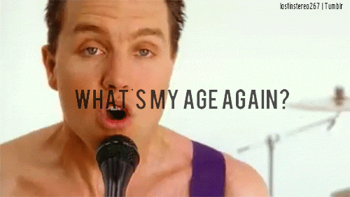 GIF: Mark Hoppus of blink-182 sings, "What's my age again?"