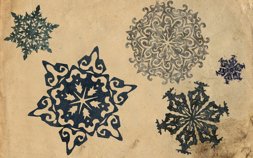 prints of different snowflakes, blue on old paper "Vintage snowflakes" by thethreesisters is licensed under CC BY 2.0.