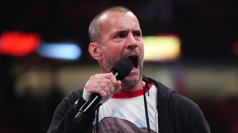 CM Punk shouting into a microphone