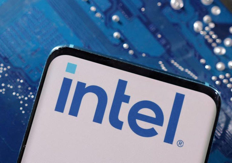 FILE PHOTO: A smartphone with a displayed Intel logo is placed on a computer motherboard in this illustration taken March 6, 2023. REUTERS/Dado Ruvic/Illustration/File Photo/