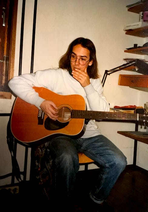 Faux Jean, hippy, with his 12 string Terrada acoustic, Germany 1990.