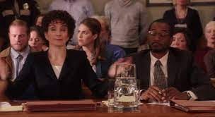 gif of Tina Fey as Marcia Clark with somebody as Chris Darden in "Kimmy Schmidt"