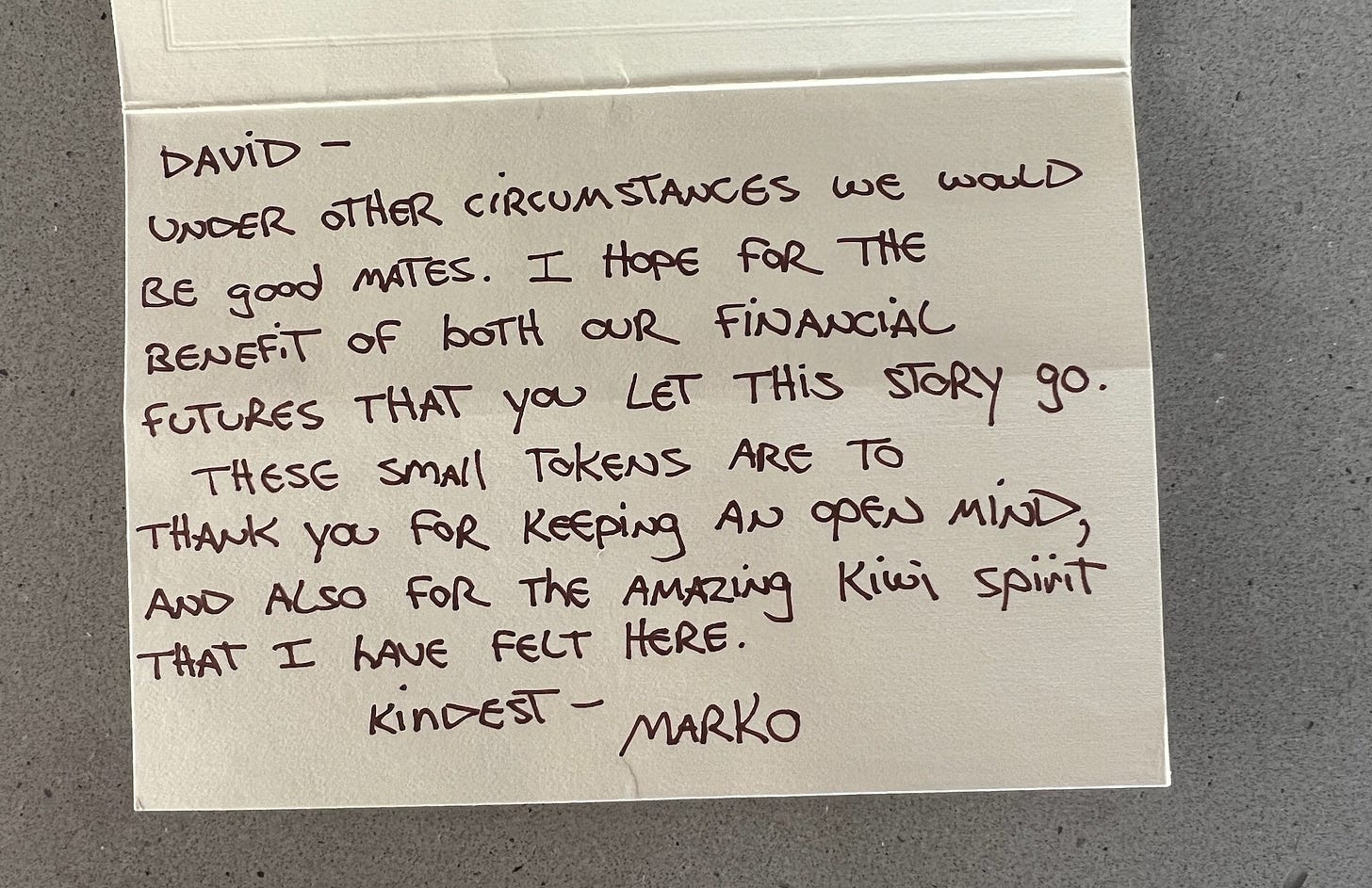 A card with Marko's and writing on it. It's written in all caps.