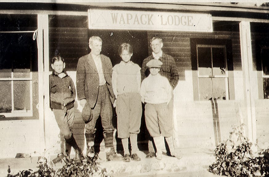 five people on porch of the Wapack Lodge