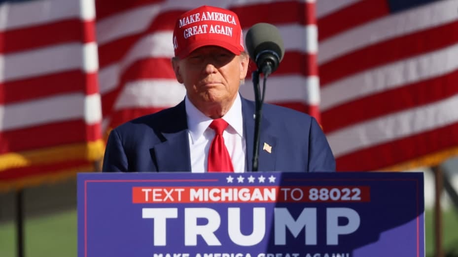 Republican presidential candidate and former U.S. President Donald Trump takes the stage at a campaign event in Freeland, Michigan, U.S. May 1, 2024. 