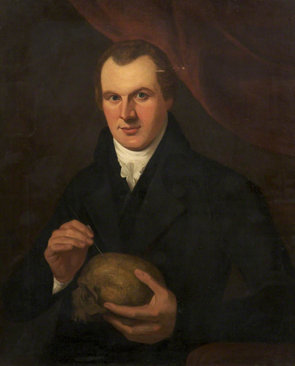 Portrait of Dr James Barlow holding a skull