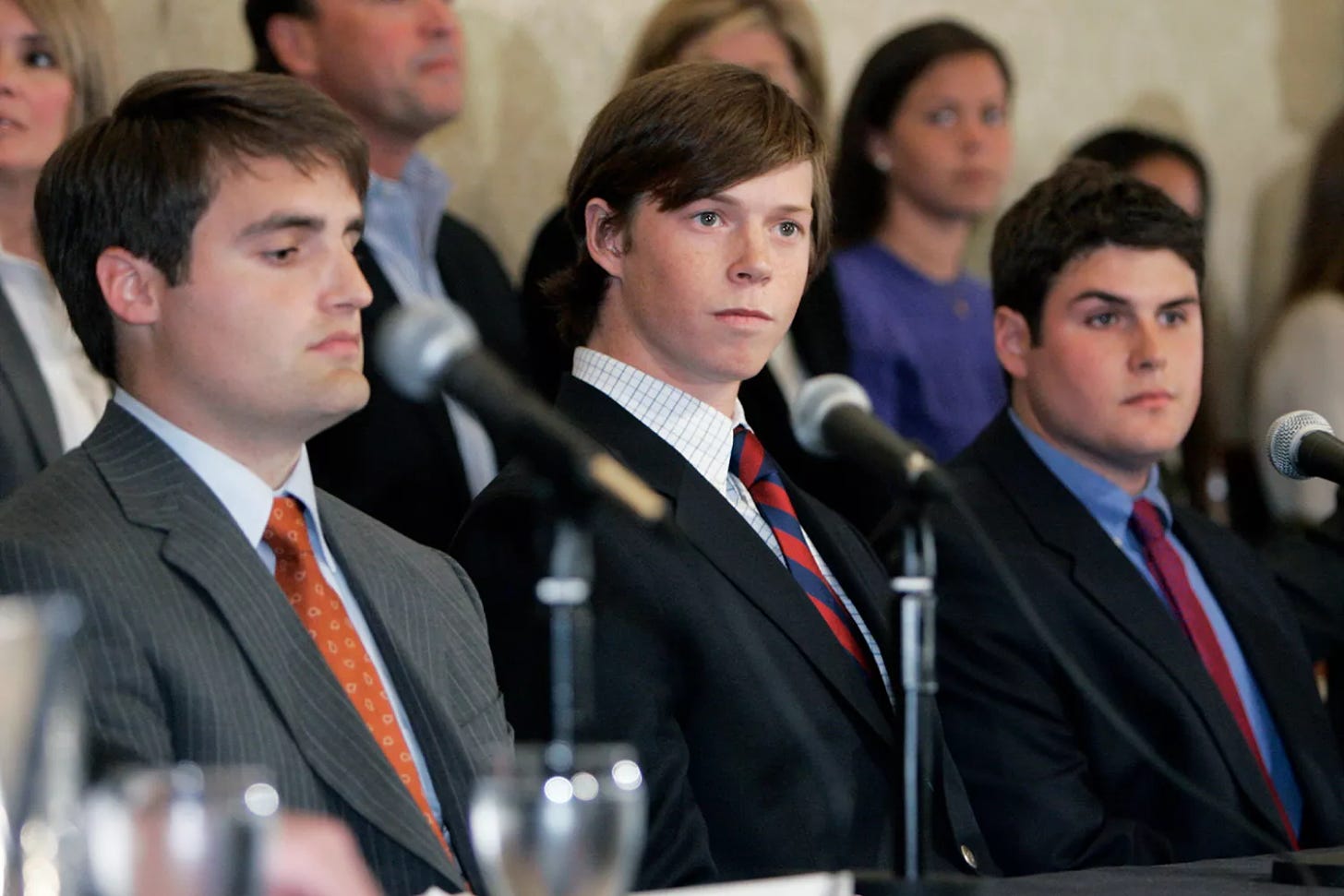 Dave Evans, Collin Finnerty and Reade Seligmann look on during a news conference on April 11, 2007, in Raleigh, N.C.