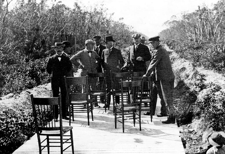 Henry Flagler and FEC executives standing on flat on railroad track in Key Largo on December 17, 1906. Courtesy of Florida State Archives.