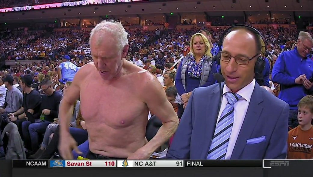 Bill Walton gets shirtless during ESPN broadcast, woman behind him grimaces