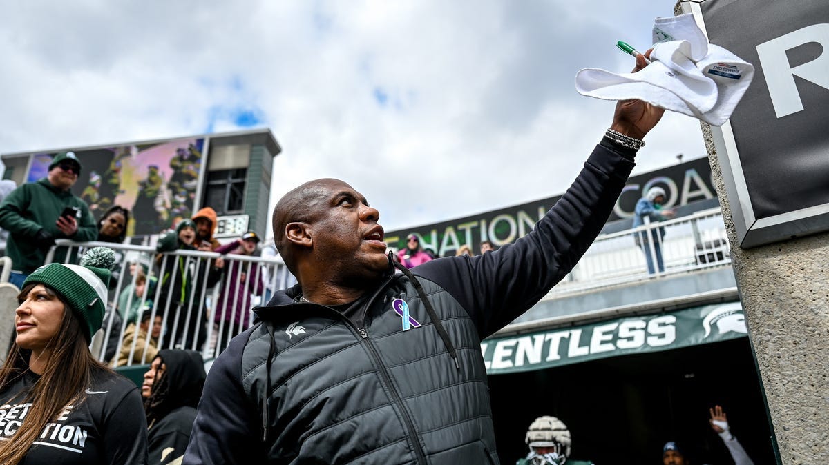 Michigan State's head coach Mel Tucker signs autographs for fans on Saturday, April 16, 2022, during the spring game at Spartan Stadium in East Lansing.