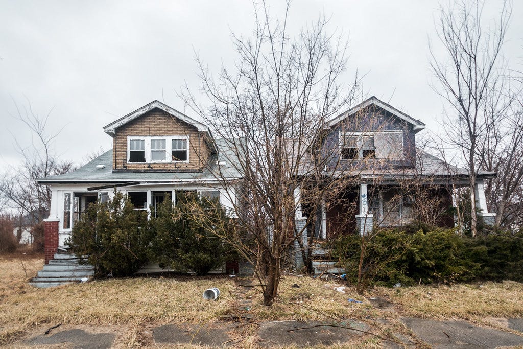 Two rundown homes in Detroit.