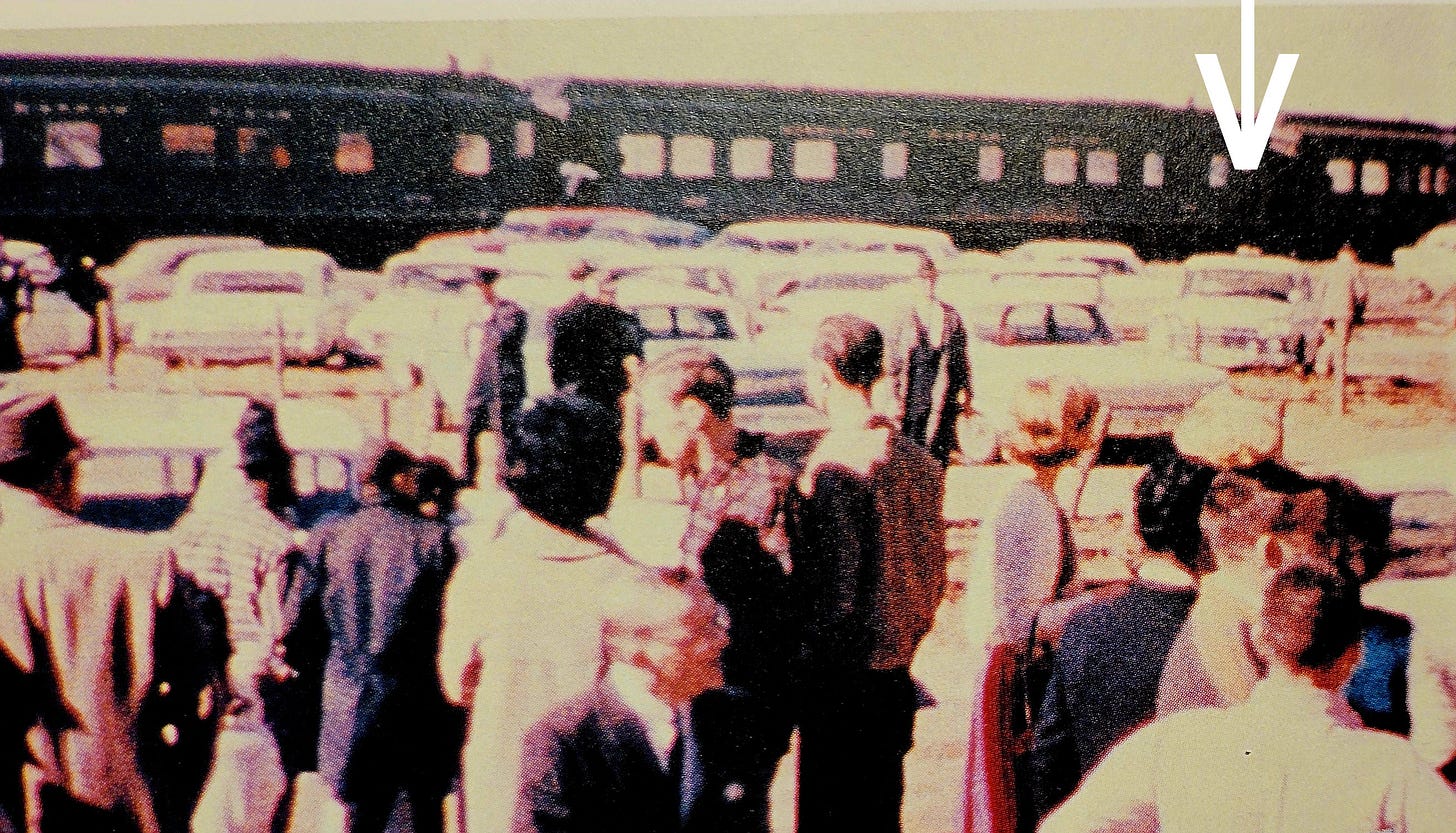 An identical Rambler is seen in the railroad yard parking area in the Mark Bell film (arrow).