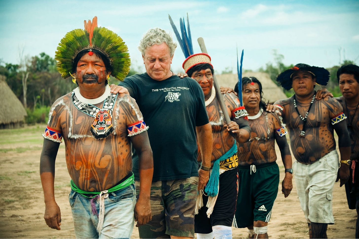 Yudja men and John Stokes dancing.