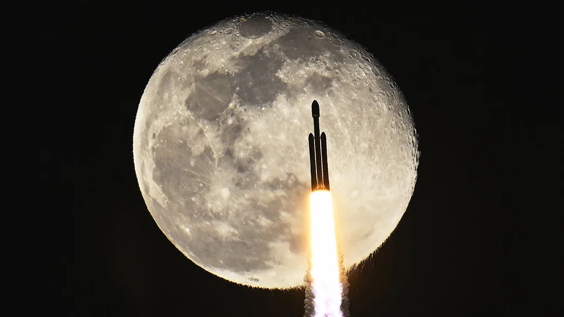 A SpaceX Falcon Heavy rocket transits a near full moon as it launches the X37B at the Kennedy Space Center, FL on Thursday, December 28, 2023