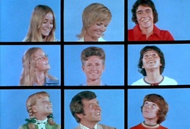 the classic scene from the opening credits of The Brady Bunch tv show, nine faces against blue backgrounds set into a 3x3 grid, all the people turning as if they are looking at each other