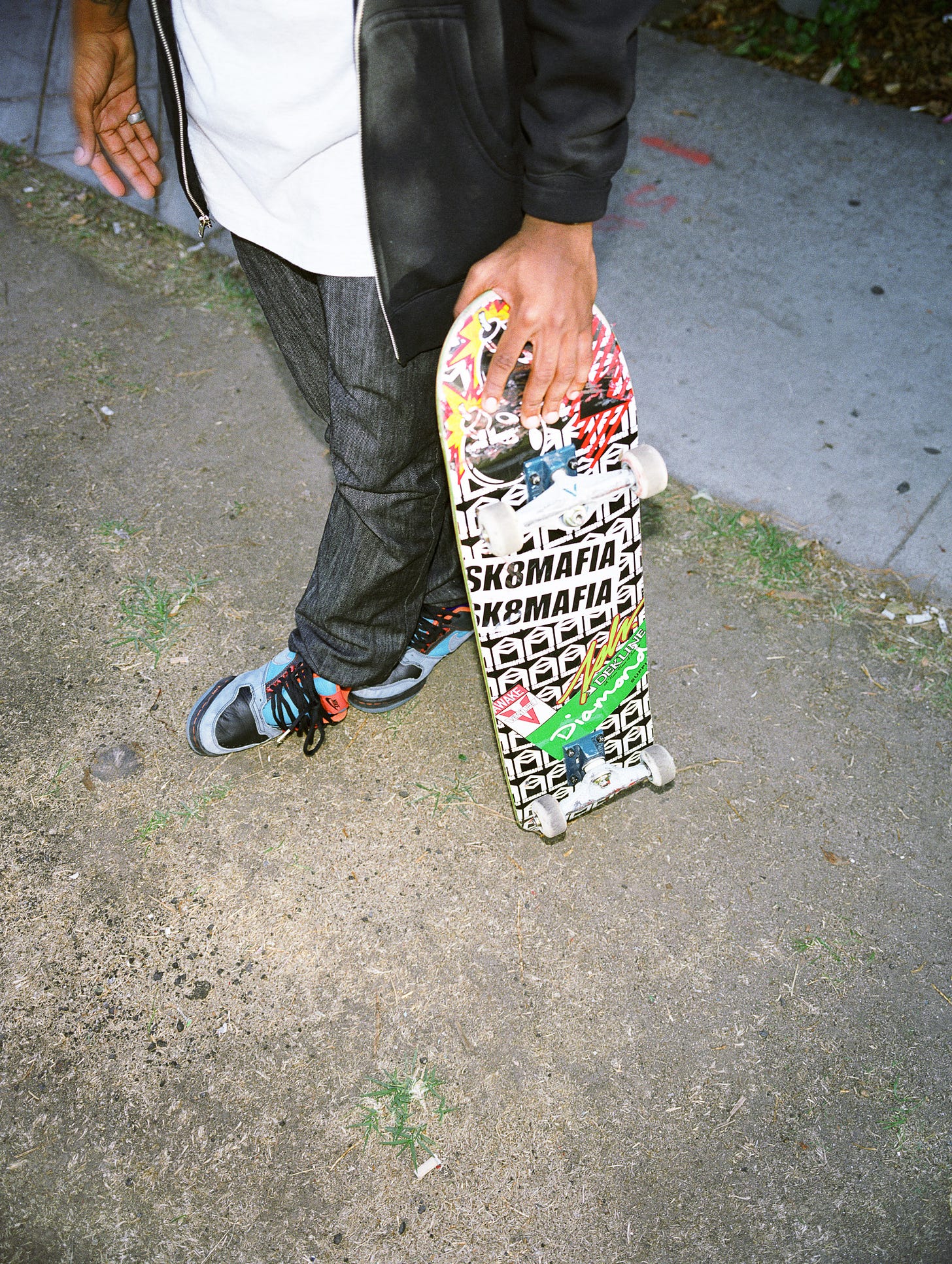 Photo of young man holding skateboard, Fairfax District, Los Angeles