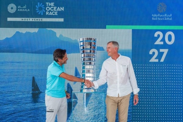 John Pagano, Group CEO of Red Sea Global, and Johan Salén, Director of The Ocean Race, shake hands to commemorate their partnership, marking a significant milestone as AMAALA prepares to host the finish of the 15th edition of The Ocean Race in the summer of 2027.