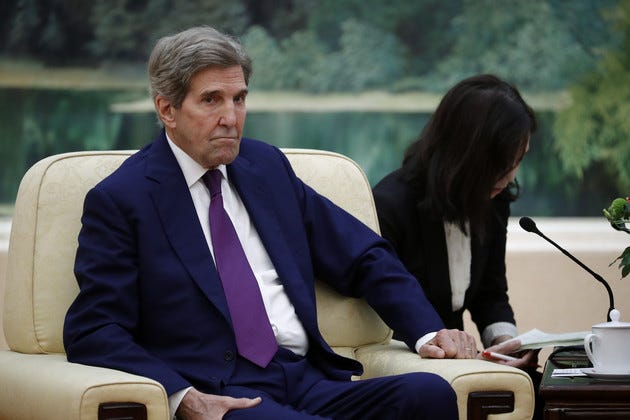 Climate Envoy John Kerry attends a meeting with Chinese Premier Li Qiang, unseen. 