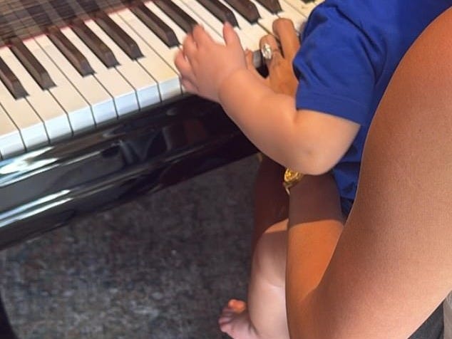 The youngster tinkered around on the keyboard
