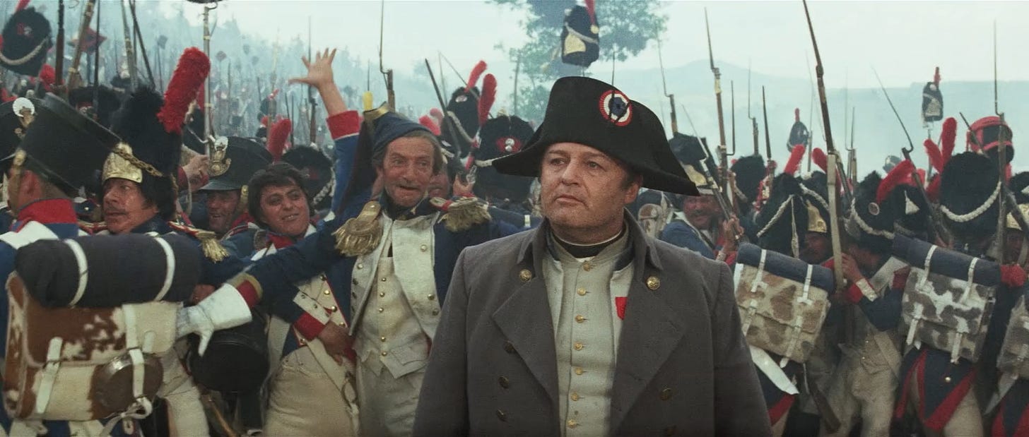 Rod Steiger at center, in costume, with battlion of soliders behind him