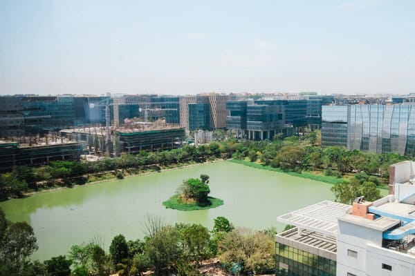 A body of water surrounded by office towers.