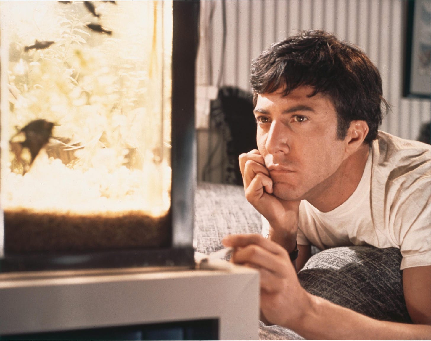 An image from the Graduate showing Benjamin starring into space