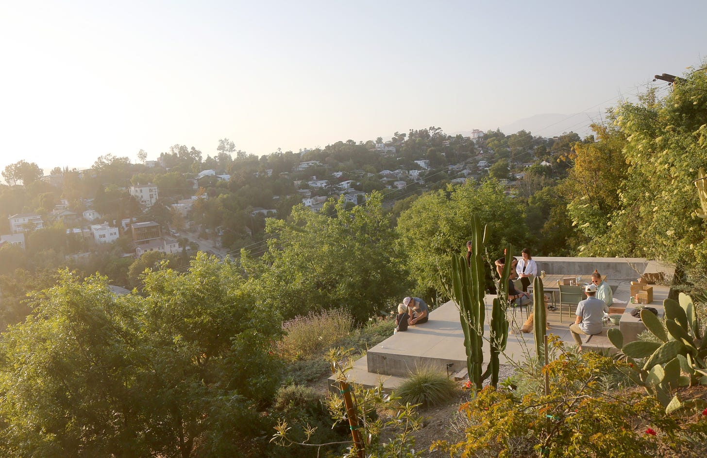 Terremoto LA's "Echo Park Monolith" image of people hanging out on a concrete landing surrounded by hills and greenery