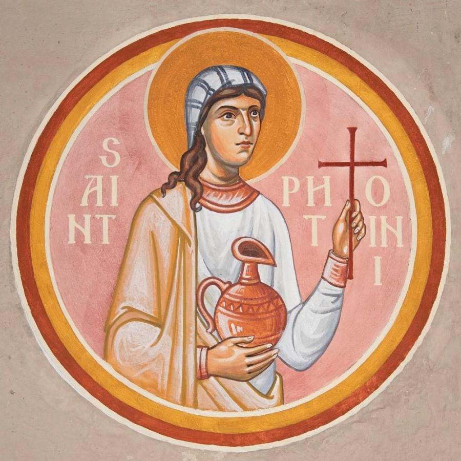 A circular icon of St. Photini. She holds a cross and a water jug.