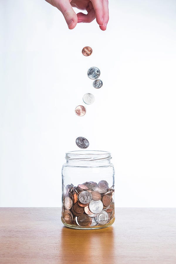 Dropping Coins Into A Jar Photograph by Chris Edwards - Fine Art America