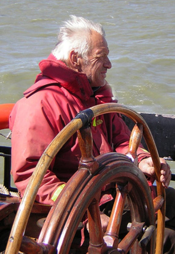 Skipper Holding the steering wheel of a boat