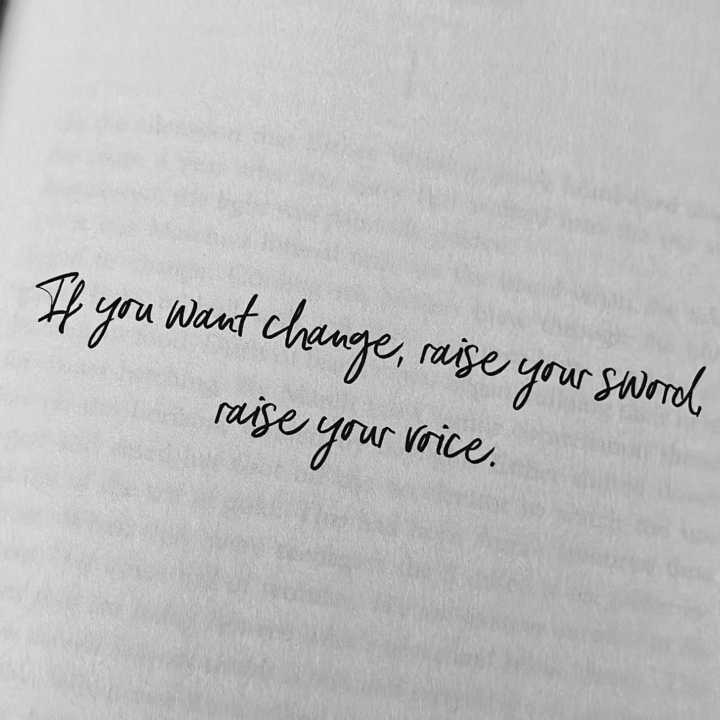 ng text that reads "If you want change, raise your sword, raise your voice.