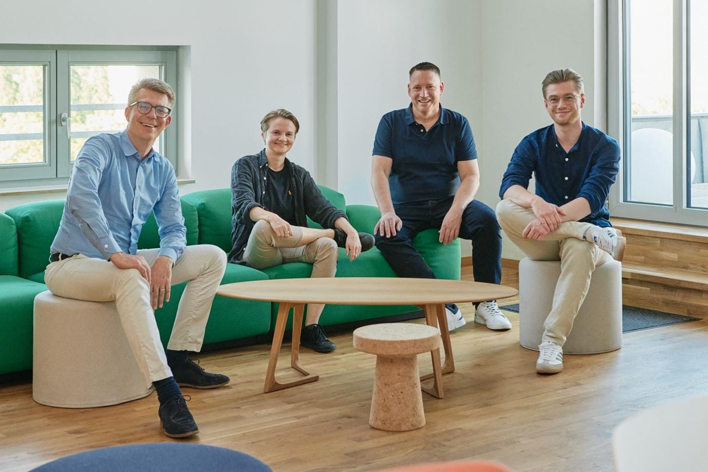 A group of people sitting on a couch

Description automatically generated