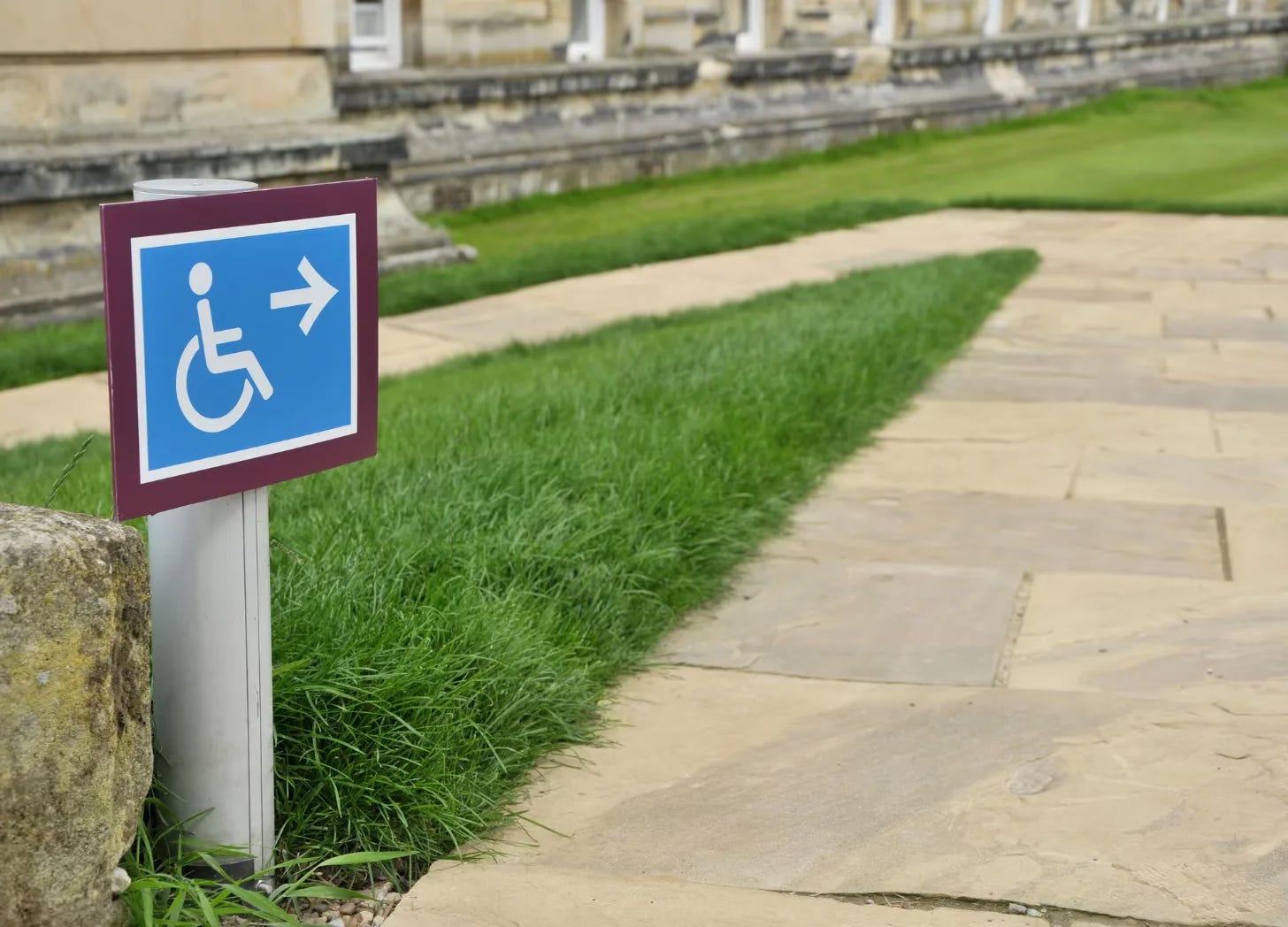 Wheelchair symbol sign marking an accessible path