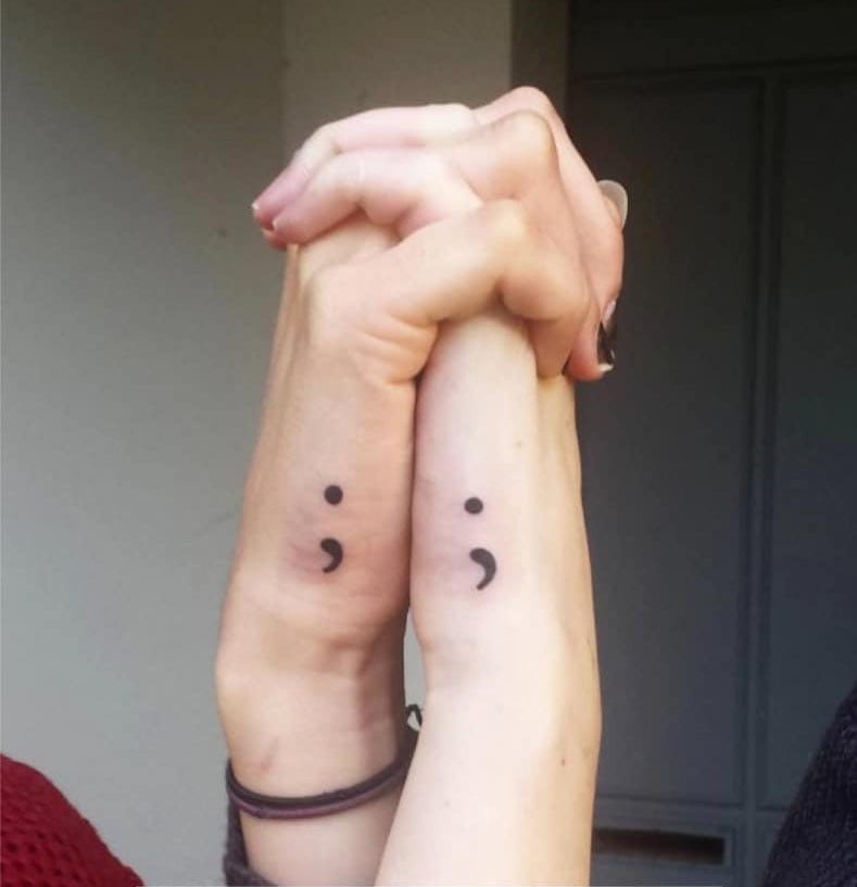 clasped hands with semicolon tattoos