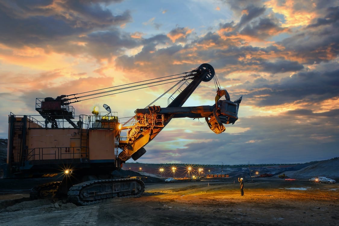 Free Yellow and Black Heavy Equipment at the Site during Sunset Stock Photo