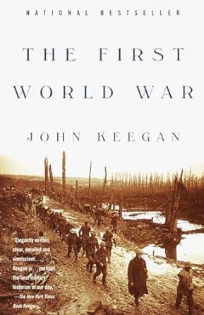 Cover of The First World War by John Keegan. The background features a sepia-toned photograph of soldiers marching through a war-torn landscape with barren trees and muddy trenches. The title and author's name are displayed in bold, serif font, with "National Bestseller" printed at the top.