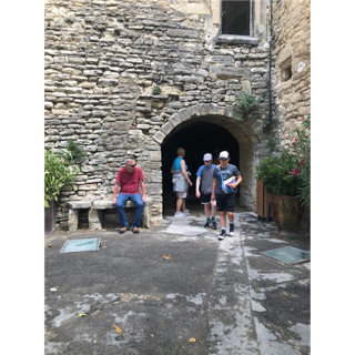 A group of people standing in a tunnel

Description automatically generated with medium confidence