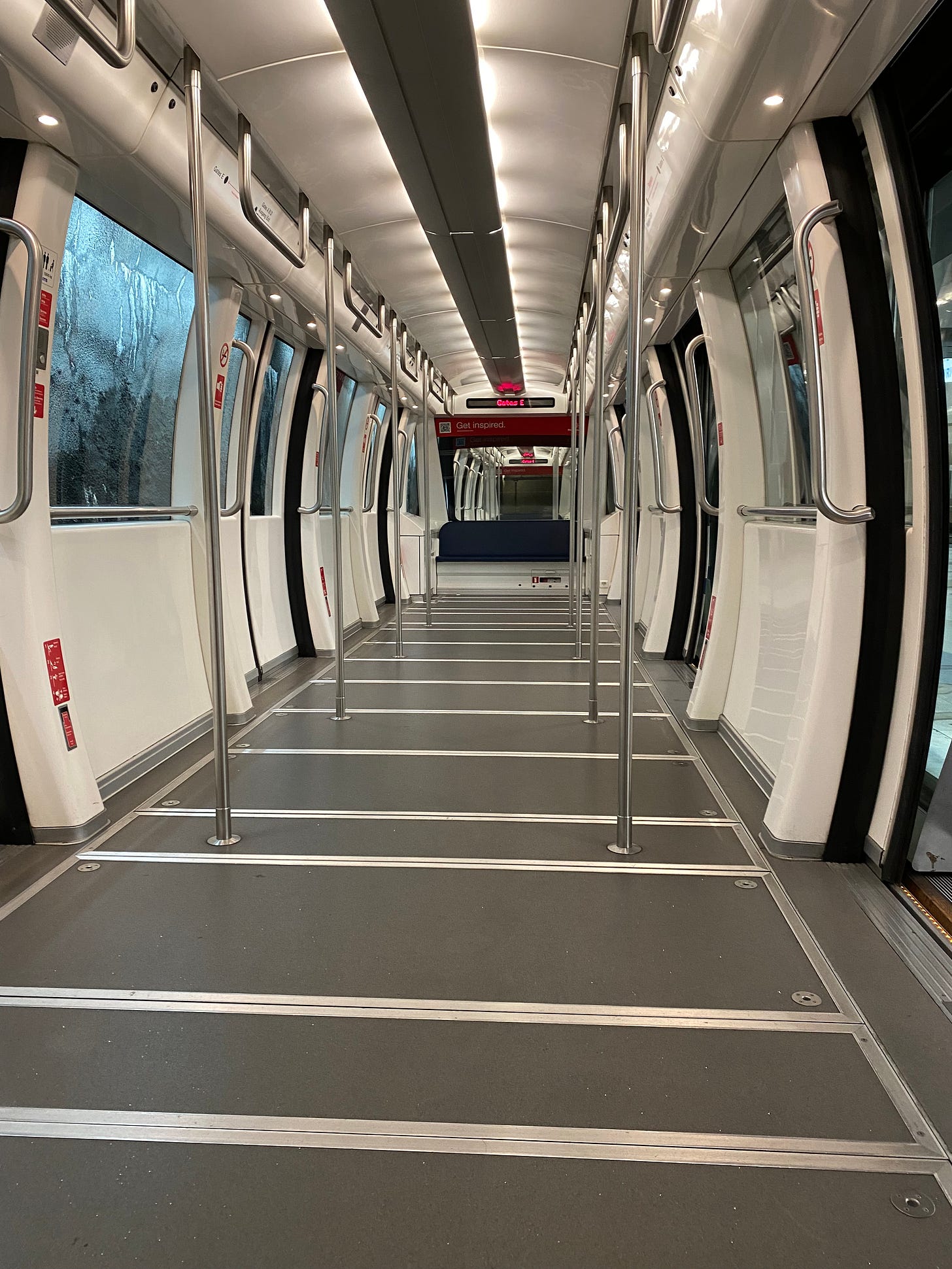 Empty interior of a Zurich Airport tram during the COVID pandemic.