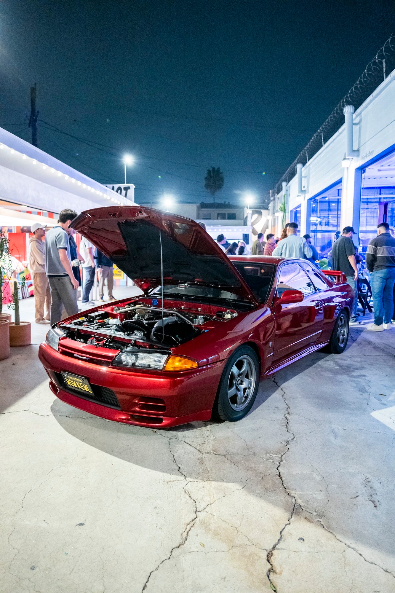 Front view of a red Nissan R32 Skyline GT-R owned by Larry Chen on display during his lecture at Race Service creative agency in Los Angeles, September 2024.