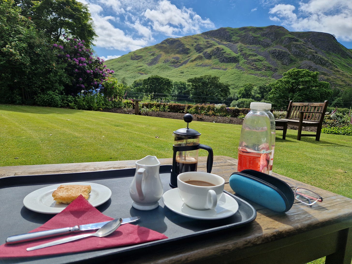 Coffee and cake at the Howton Hotel with garden and hills in background.