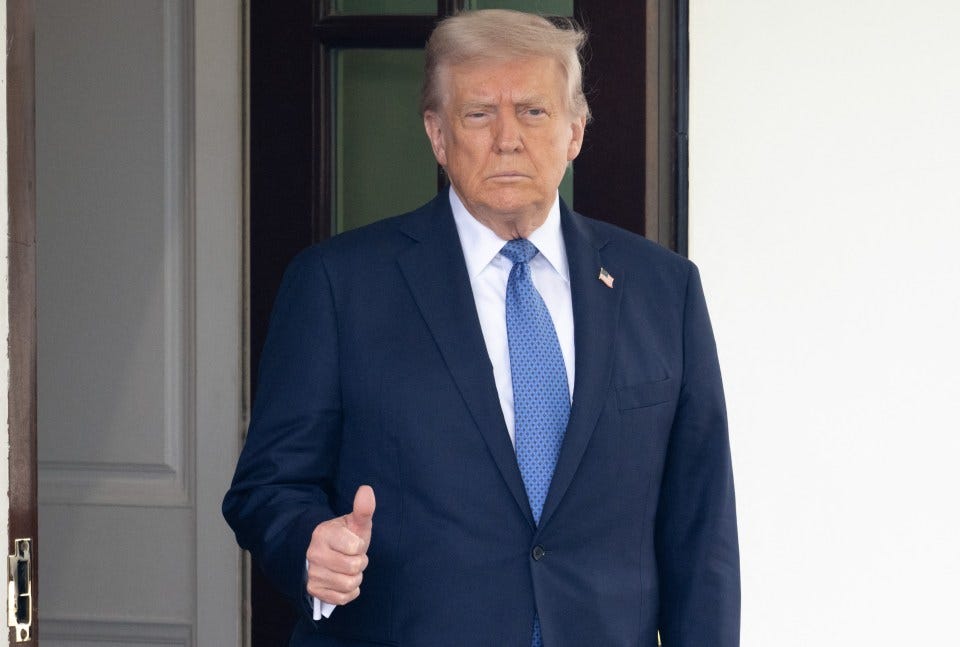 Donald Trump giving a thumbs up.