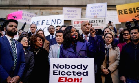 Democrat Jasmine Crockett speaks as demonstrators rally outside the US treasury department after it was reported billionaire Elon Musk has gained access to the federal payments system.