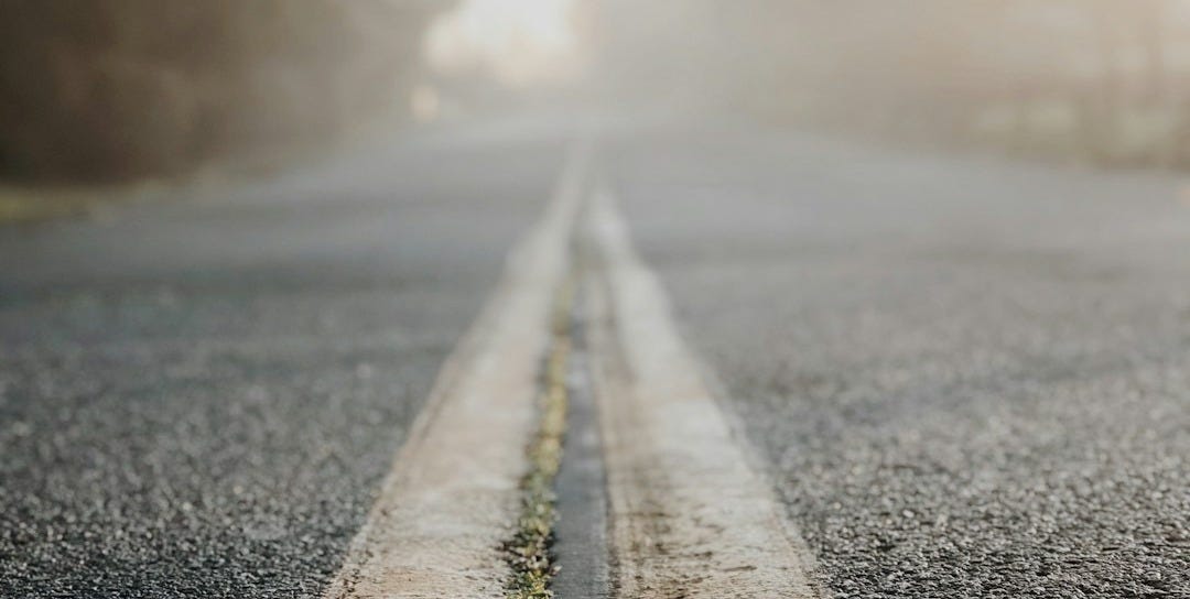 two yellow lines in middle of road two yellow lines in middle of road