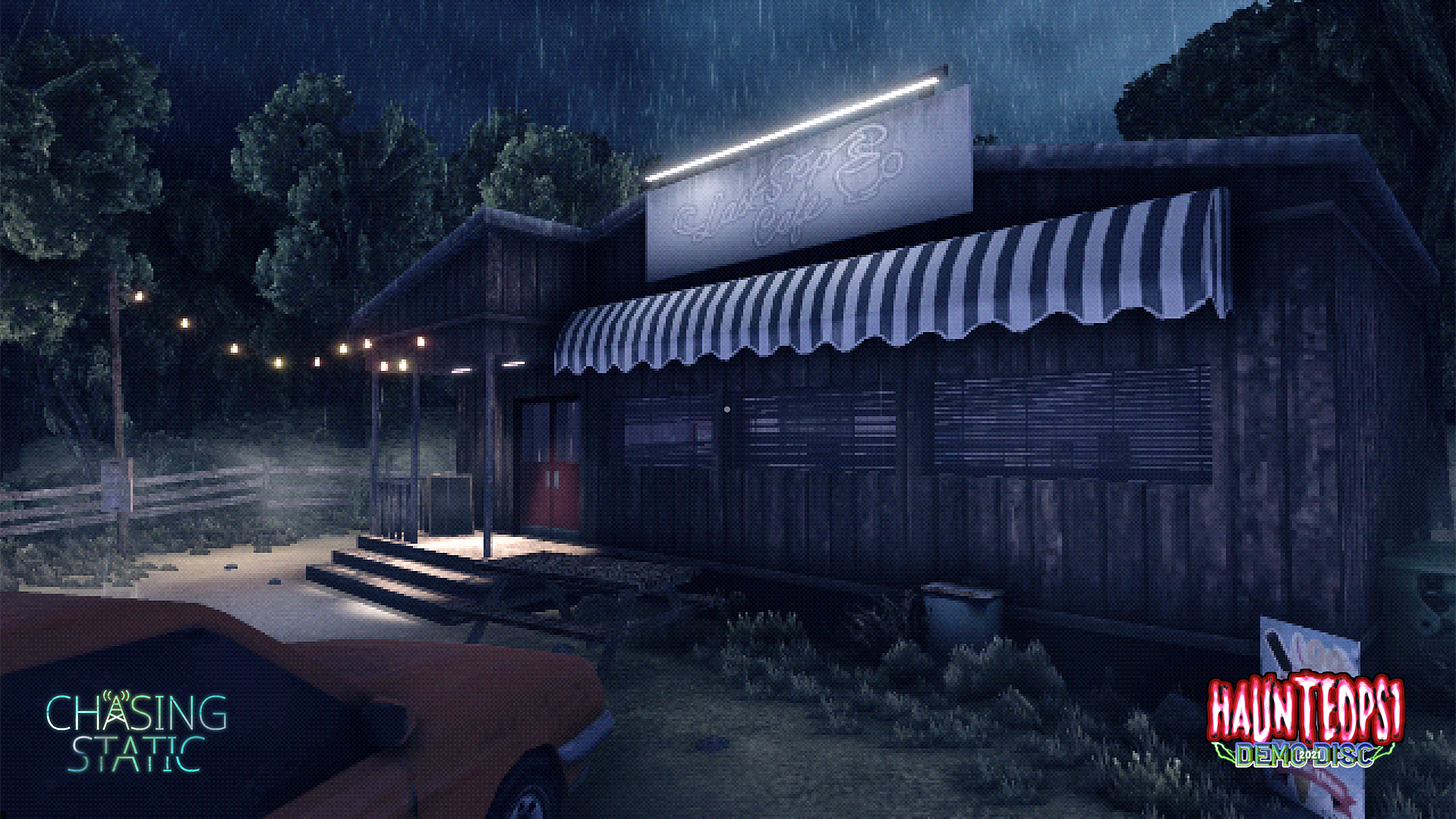 Chasing Static, featured on the Haunted PS1 Demo Disc 2021. A diner called the Last Stop Cafe in the rain, surrounded by trees. A string of lights illuminates the entrance. An orange car is parked in front.