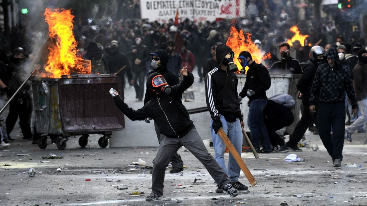Greek lawmakers pass new austerity law despite protests | CNN Business