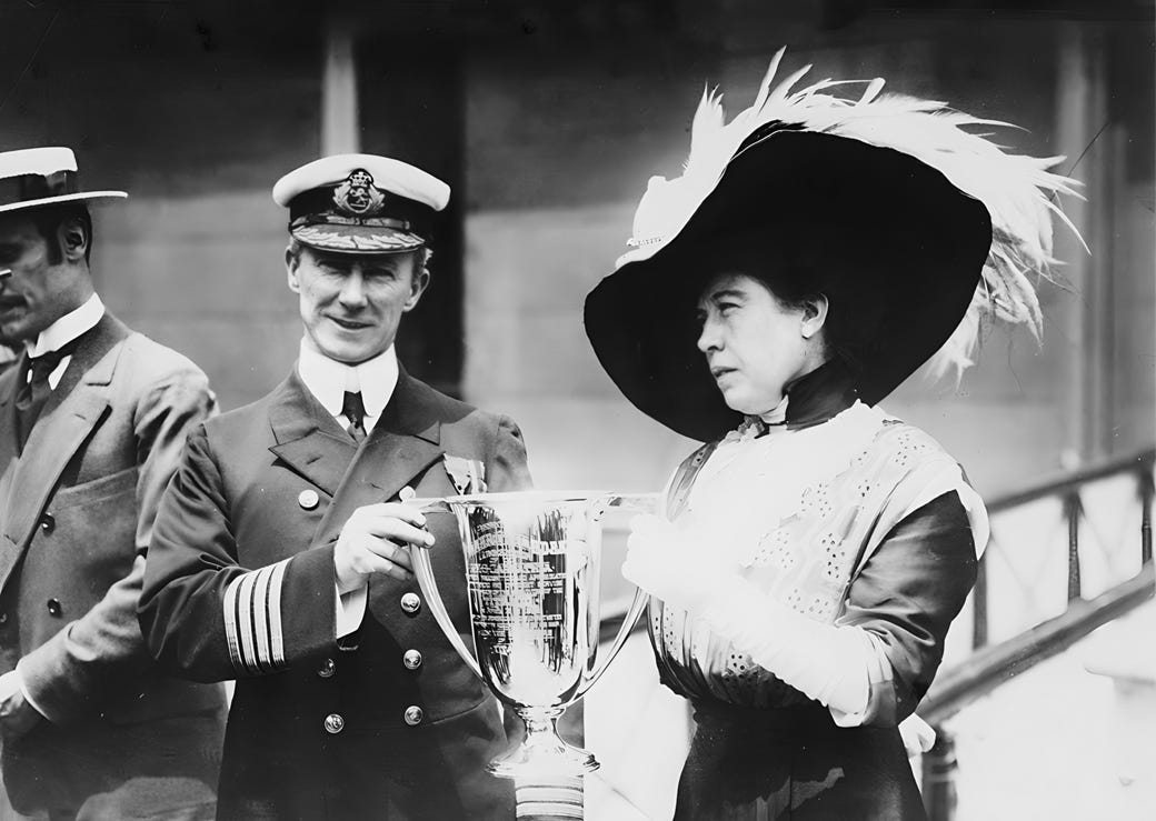 Carpathia Captain Arthur Henry Rostron presented with a “loving cup” trophy by Titanic survivor “Unsinkable” Molly Brown, 29 May 1912, public domain, via Wikimedia Commons (enhanced)
