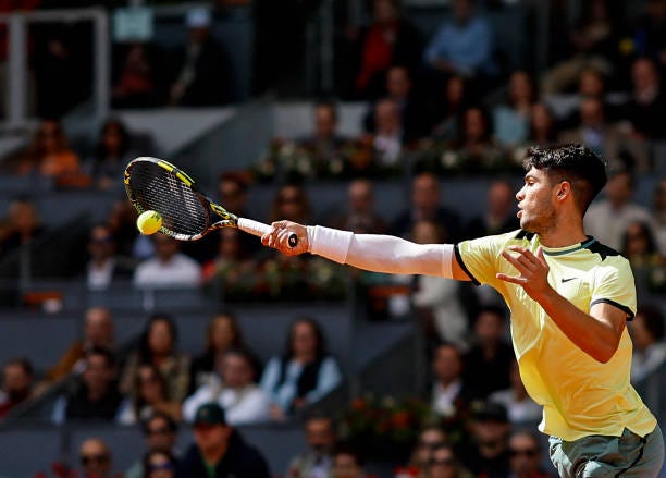 Spain's Carlos Alcaraz returns to Brazil's Thiago Seyboth Wild during the third round of the 2024 ATP Tour Madrid Open tournament tennis match at...