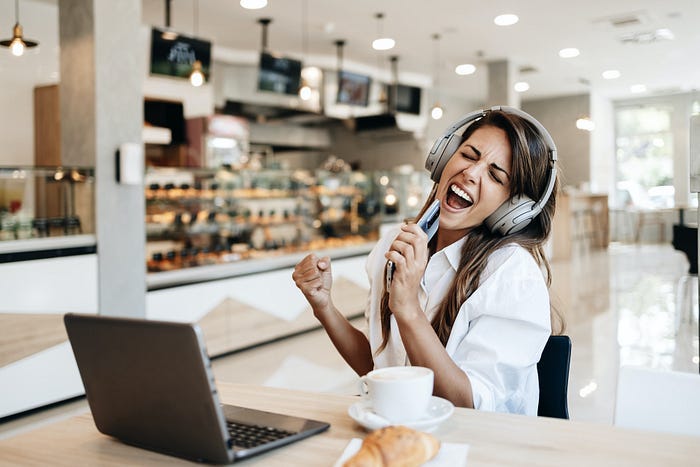A woman working in the morning on a laptop and having a great time. A woman working in the morning on a laptop and having a great time.