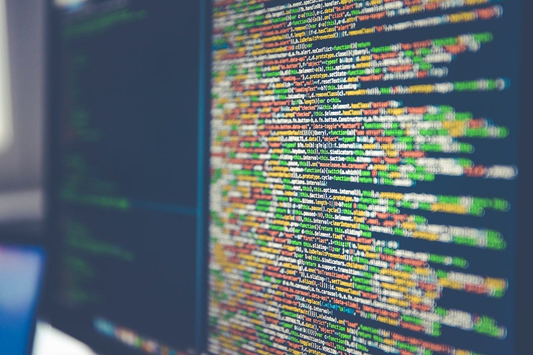 Colorful software or web code on a computer monitor Colorful software or web code on a computer monitor