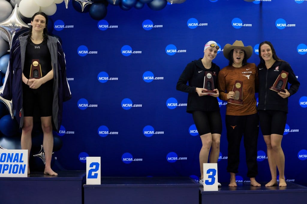 Thomas stands on the first place podium as other medalists Emma Weyant, Erica Sullivan and Brooke Forde pose together at the NCAA Division I Women's Swimming & Diving Championship on March 17, 2022.